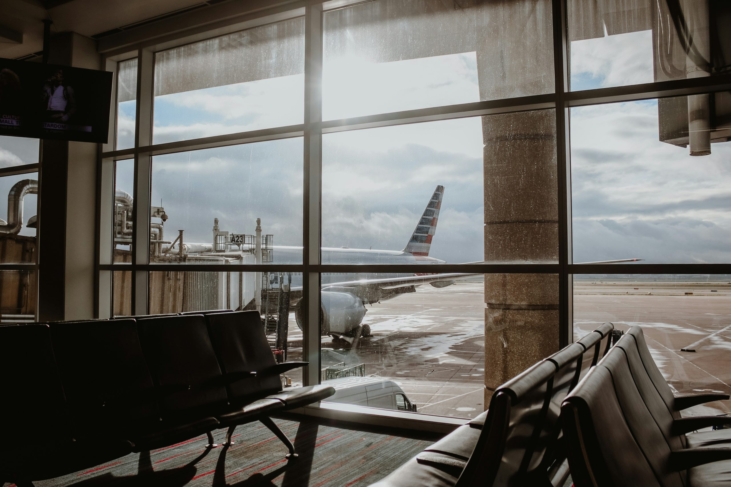 the aeroplane at an airport from the waiting area